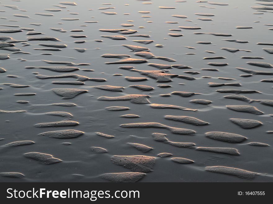 3D abstract effect created with sand and water in soft evening light. 3D abstract effect created with sand and water in soft evening light.