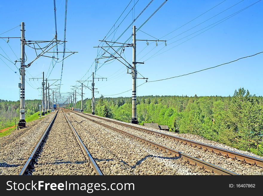 Two railway ways in summer for movement of trains on electrodraft. Two railway ways in summer for movement of trains on electrodraft