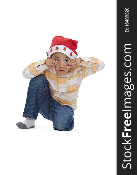 Cute boy with santa claus hat, isolated on white background