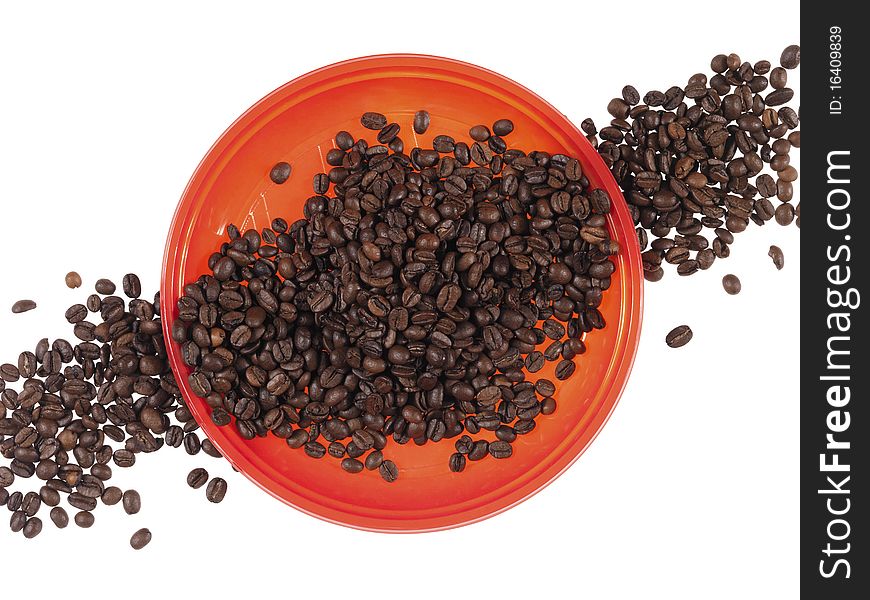 Red dish full of  coffee beans on the white background. Red dish full of  coffee beans on the white background