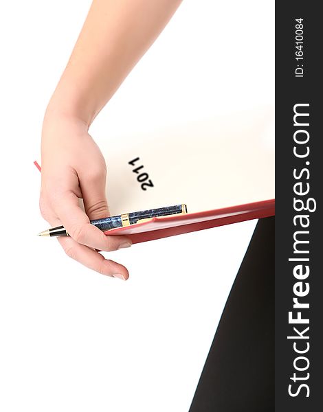 Woman holding a pen and a 2011 agenda. Woman holding a pen and a 2011 agenda