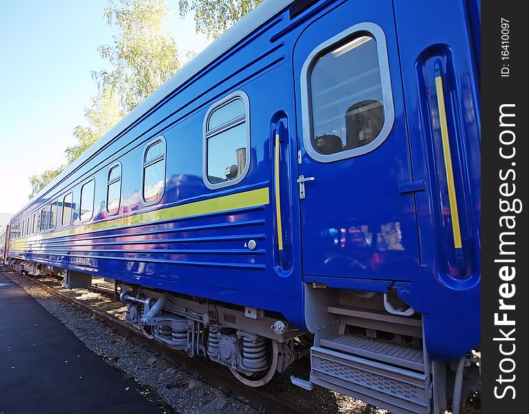 Blue passenger wagon at the railway station