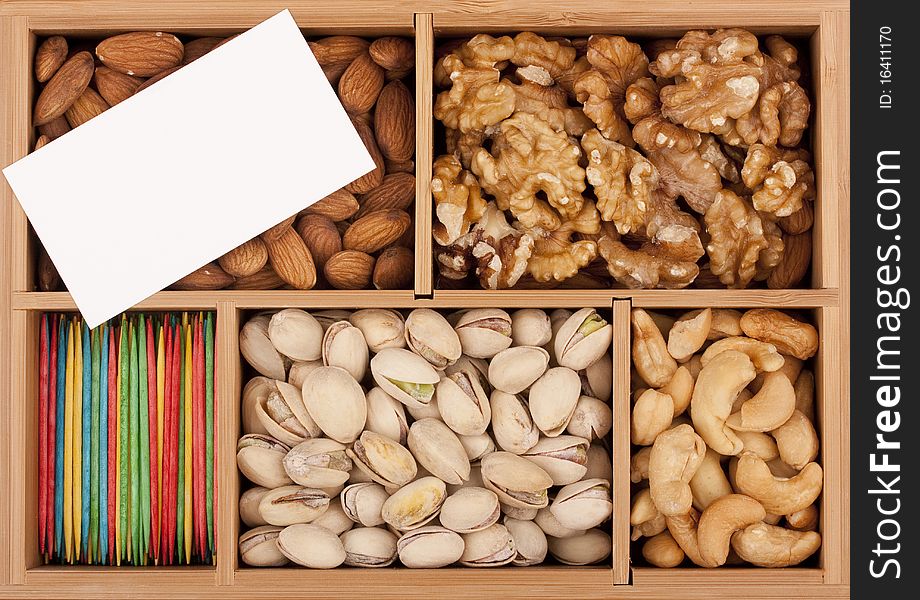 Nuts of different grades in a wooden box.