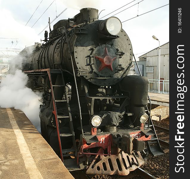 Russian steam locomotive on the railway. Russian steam locomotive on the railway