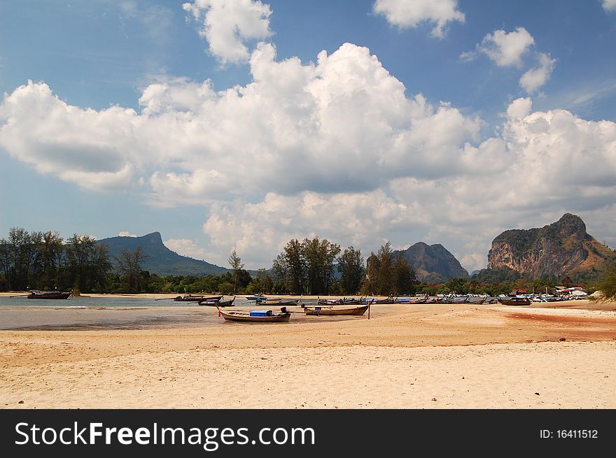 Boats on the beach in Krabi, Thailand.