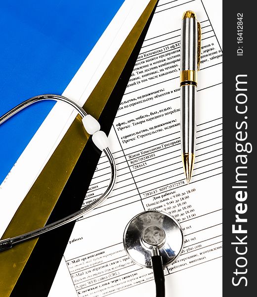 A stethoscope on a patients medical record