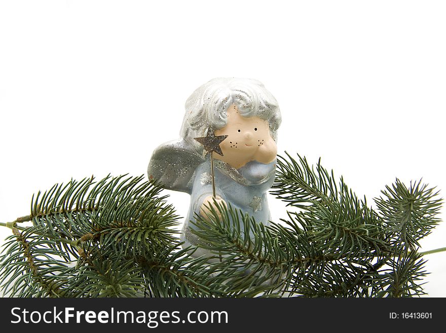 Christmas angel with star and fir branch