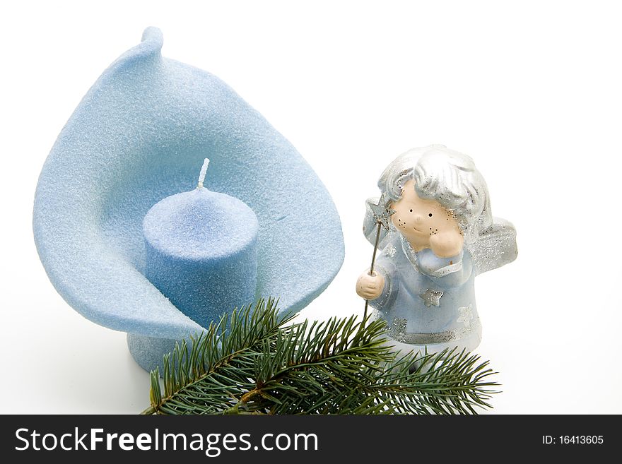 Christmas angel with candle and fir branch