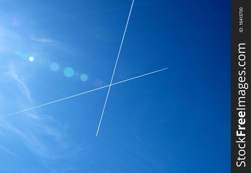 Trace of two airplanes in the pure blue sky