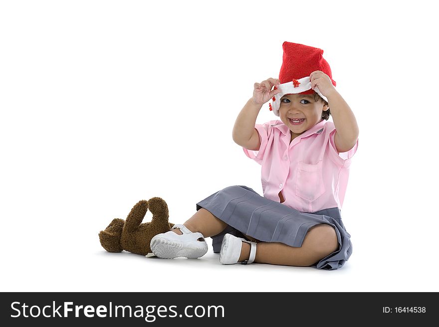 Happy cute girl with santa hat, isolated on white background