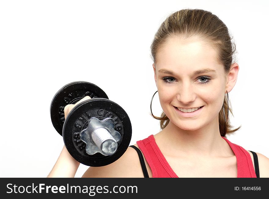 Young sporty woman with a dumbbell. Young sporty woman with a dumbbell