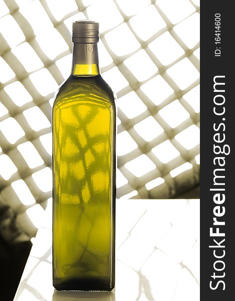 Olive oil bottle still-life over sepia background