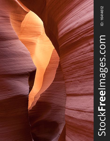 Lower Antelope Canyon near Page in Arizona, USA, close to the Grand Canyon. Red Sandstone canyon with amaizing light beams and coulors. Slot opens to the back of the image with higher illumination giving the stone a lighter colour than in the foreground.