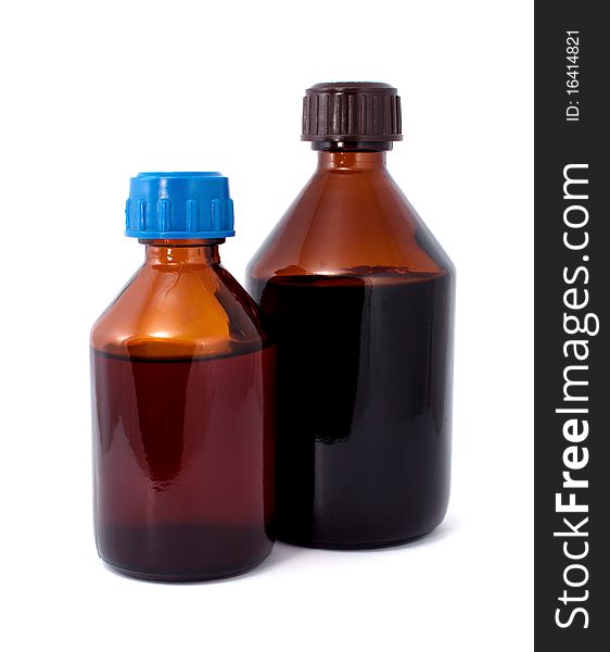 Two brown glass bottles isolated on white. Two brown glass bottles isolated on white