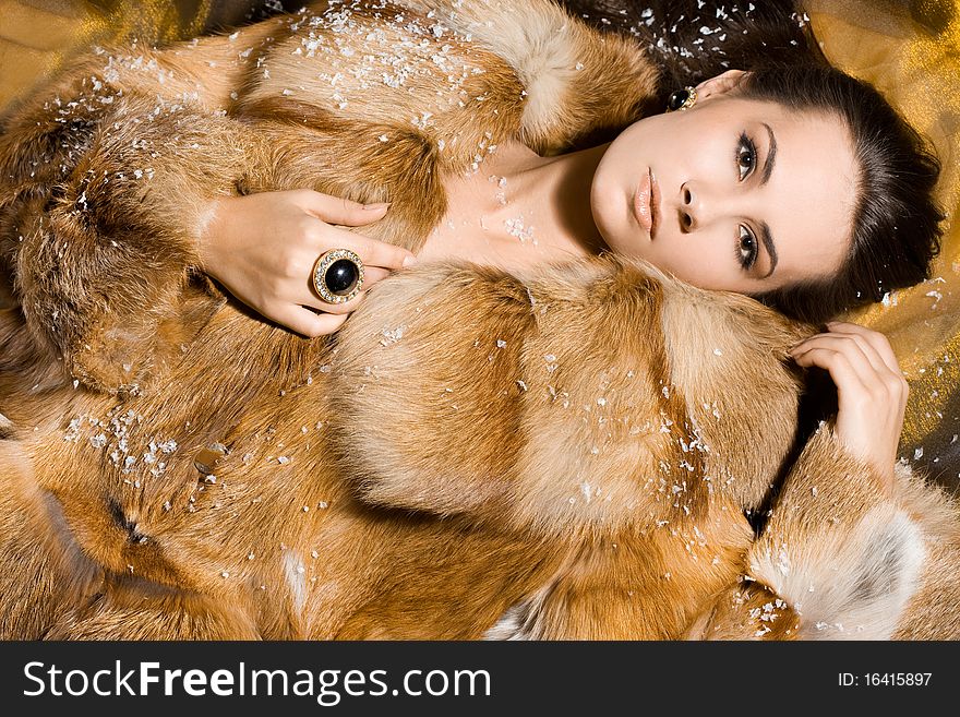 Beautiful woman in a fur coat