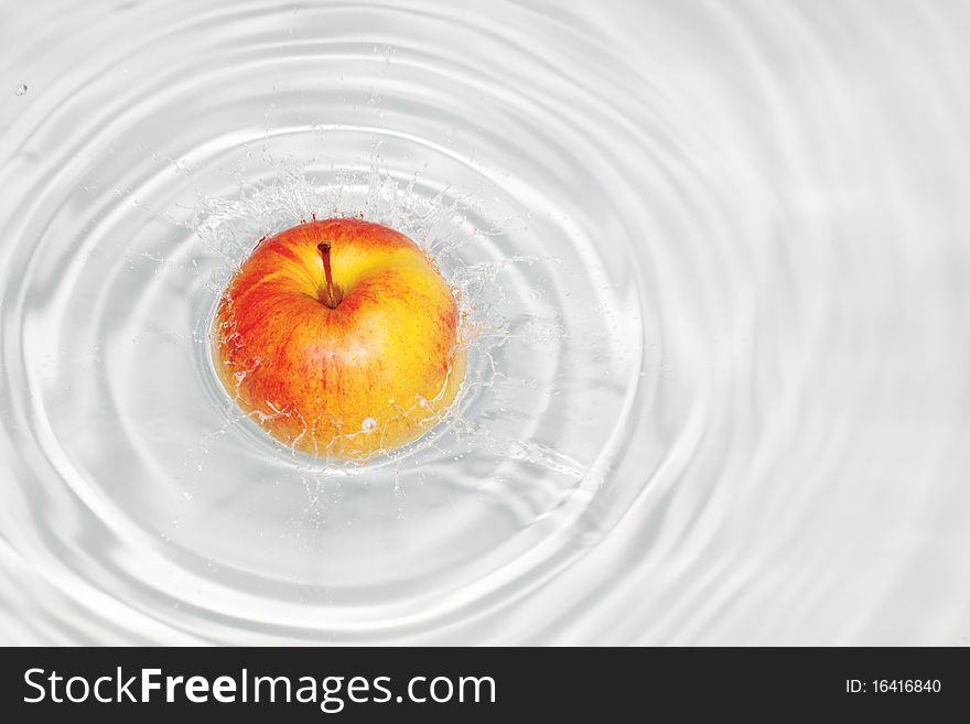 Symbol of freshness; fruits splash in water. Symbol of freshness; fruits splash in water