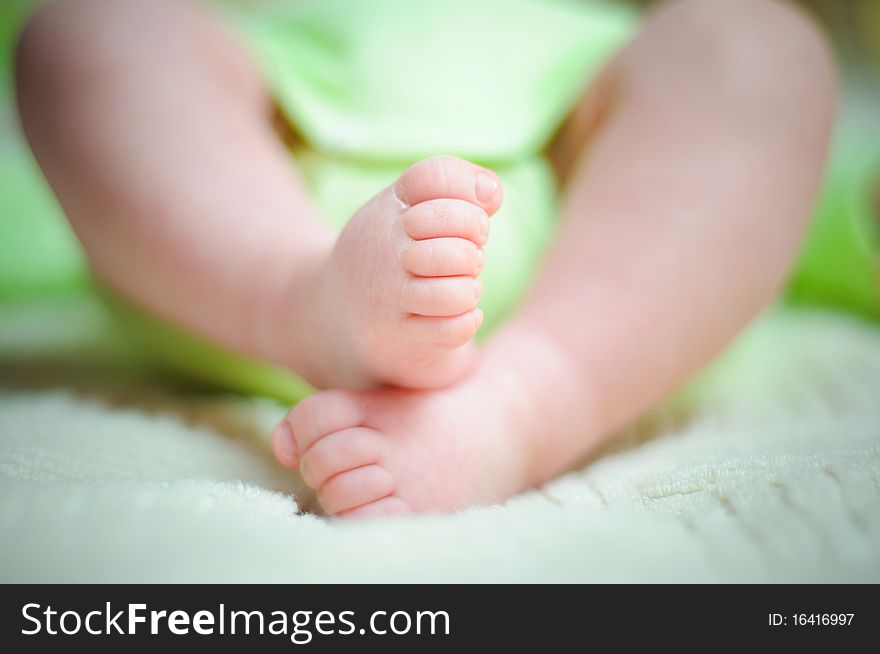 Little fingers. Legs newborn baby