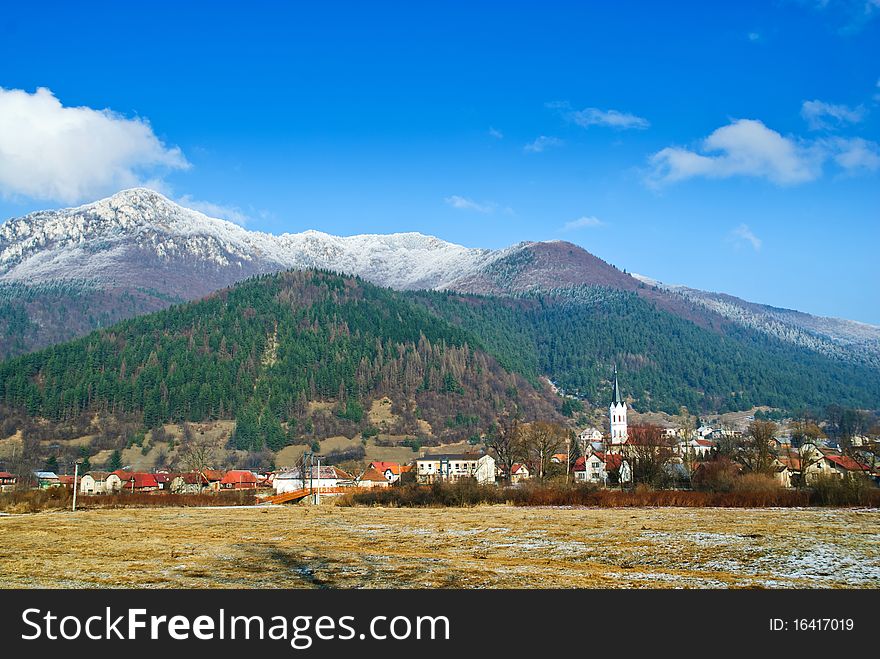 Village At The Foot Of The Mountains