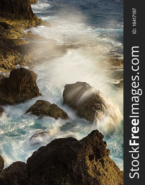 Wave crashing on Aruban coastline during sunrise. Wave crashing on Aruban coastline during sunrise