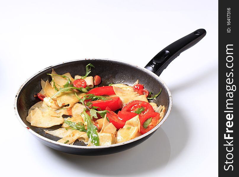 Preparing an appetizer on a frying pan