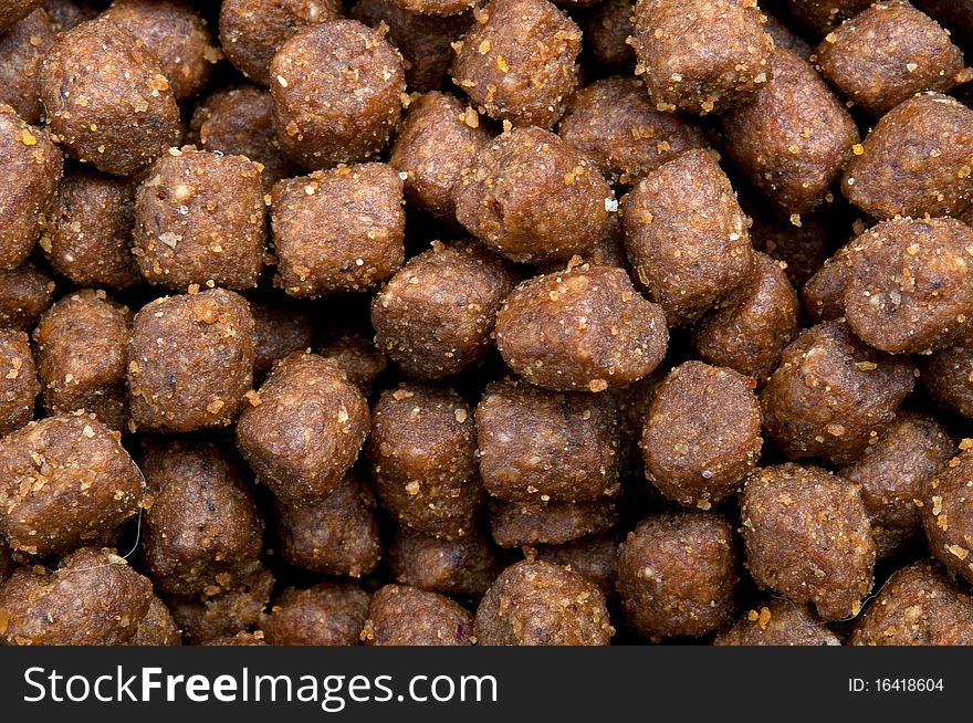 Dry pets food background, horizontal