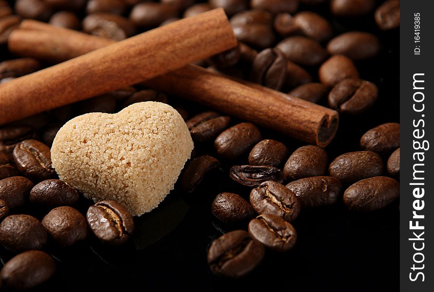 Sugar in shape as heart on coffe seed with canella