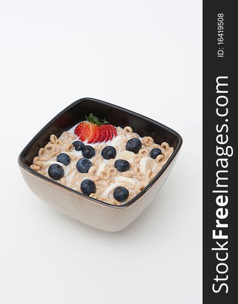 Organic cereal with strawberries, bananas and blueberries. Organic cereal with strawberries, bananas and blueberries