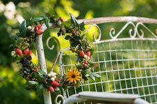 Autumn Wreath With Berries On A Garden Bench Stock Photos