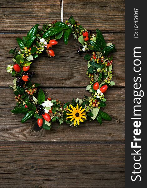 Autumn Wreath With Berries On A Wodden Background