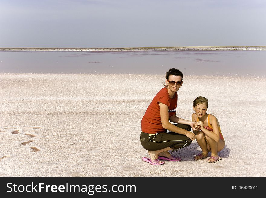 Mum And Daughter On Salty Lake