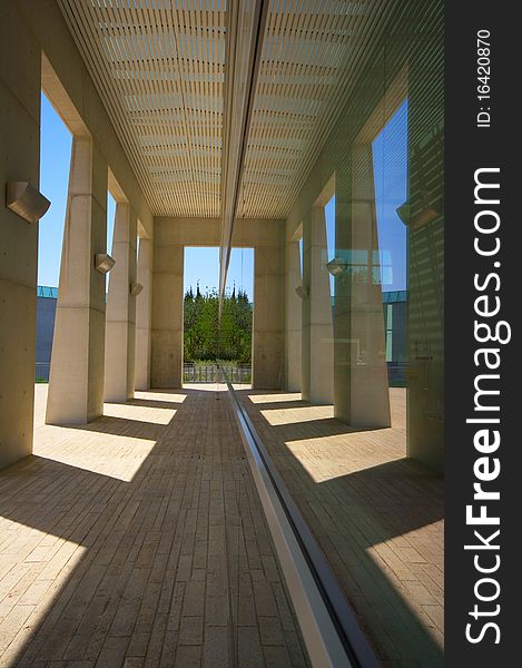 A covered walkway of a modern work of architecture. A covered walkway of a modern work of architecture