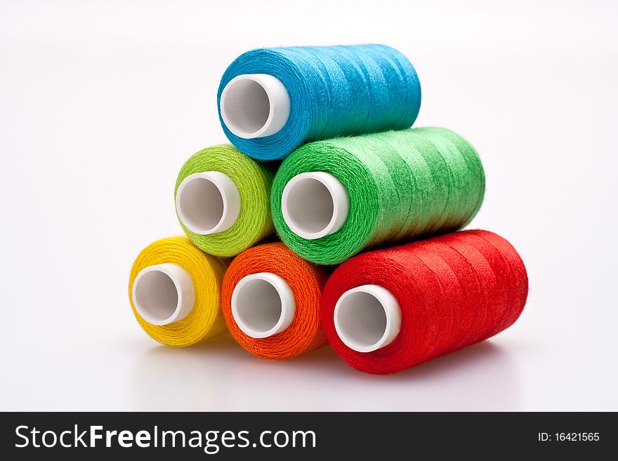 Multi-colored rainbow threads for sewing. Multi-colored rainbow threads for sewing