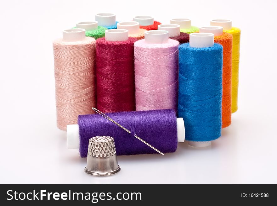 Colored thread for sewing with needle and thimble