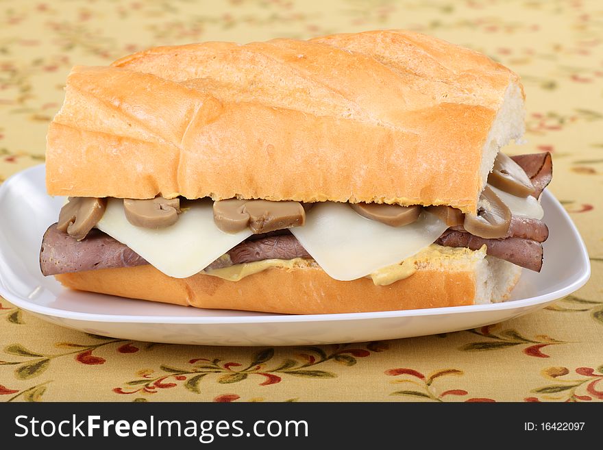 Roast beef with cheese, mushrooms and mustard sandwich. Roast beef with cheese, mushrooms and mustard sandwich