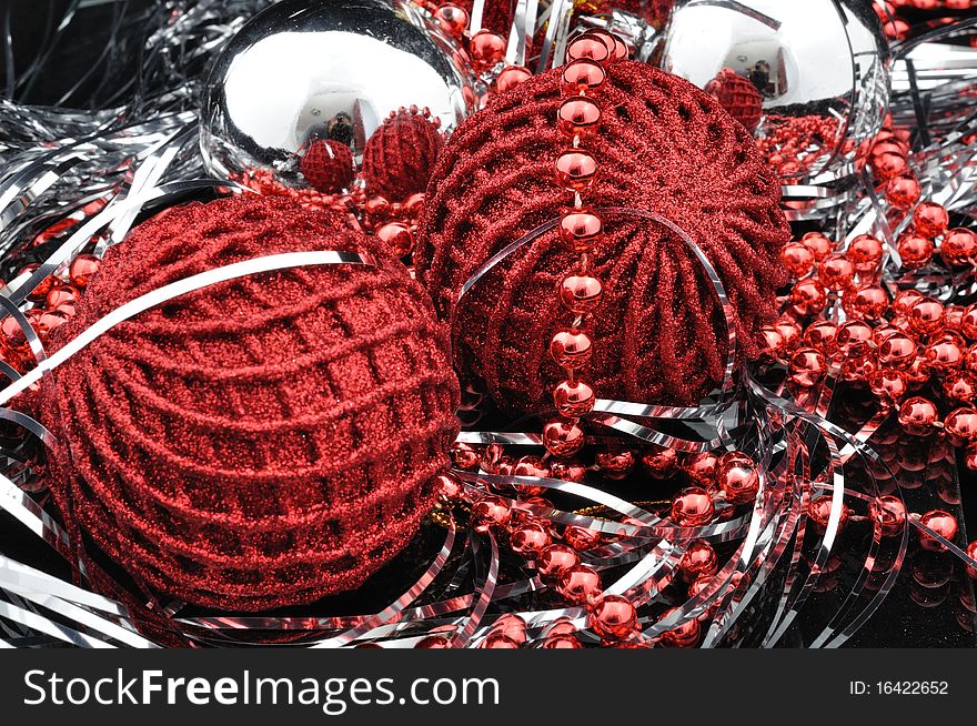 Red christmas balls over black