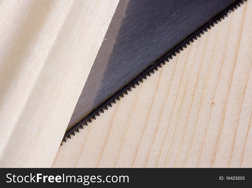 Sharp saw blade on a piece of wood.