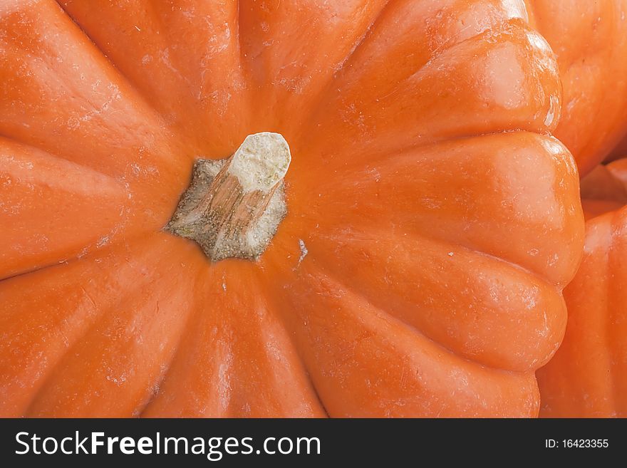 Small orange pumpkins symbolising autumn holidays and used in decorative works.