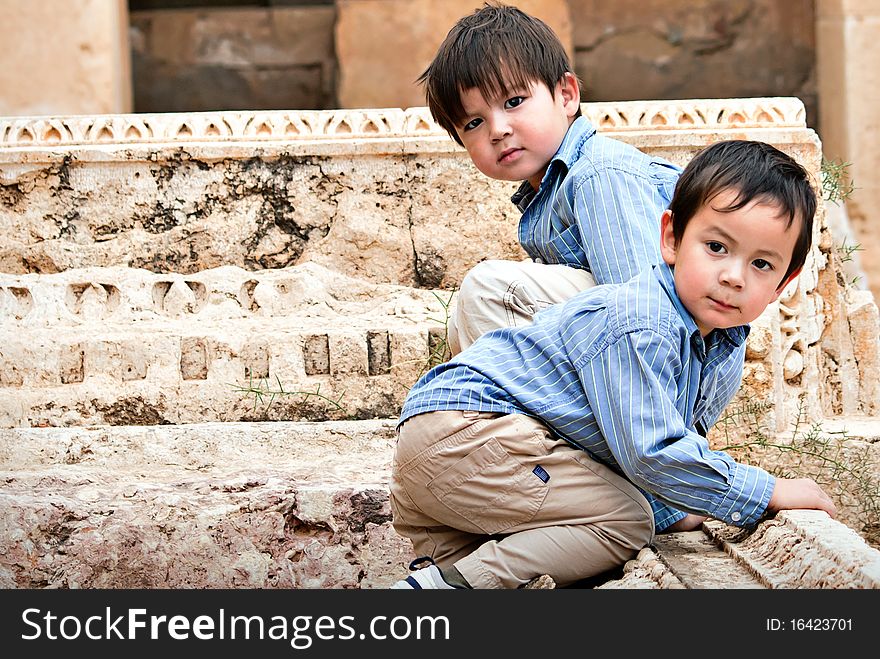 Brothers playing on Roman Ruins. Brothers playing on Roman Ruins