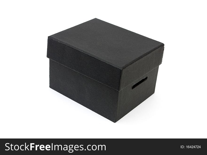 Black box with lid on a white background covered in black cloth