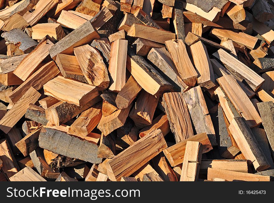 A background photo of fire wood on one heap in chaotic position. A background photo of fire wood on one heap in chaotic position.