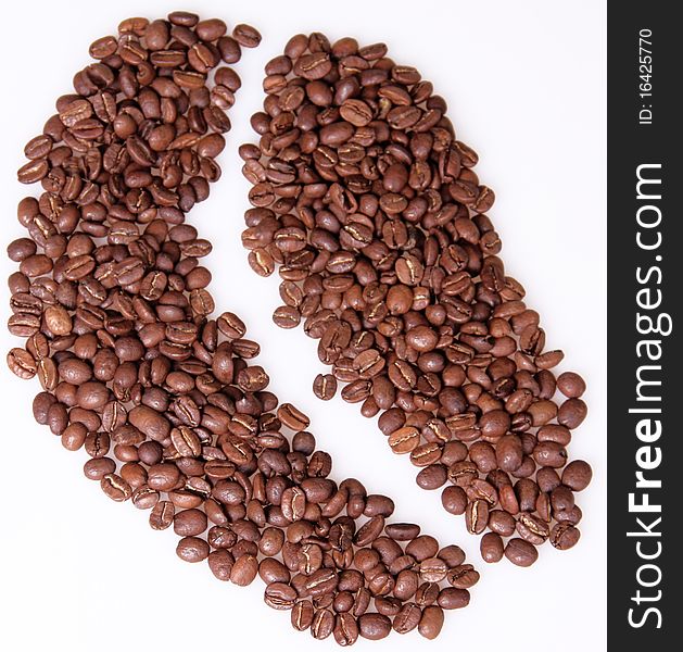 Coffee grains are laid out in the form of one coffee grain