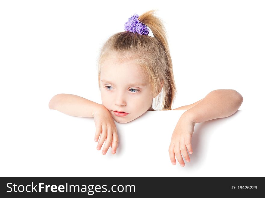 Little girl looking over empty board isolated