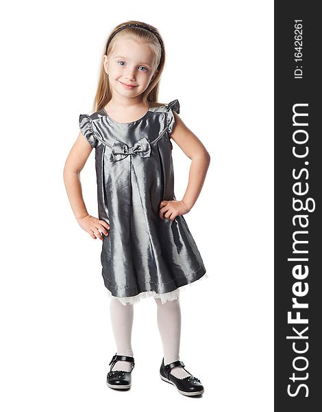 Cute smiling little girl in grey dress isolated