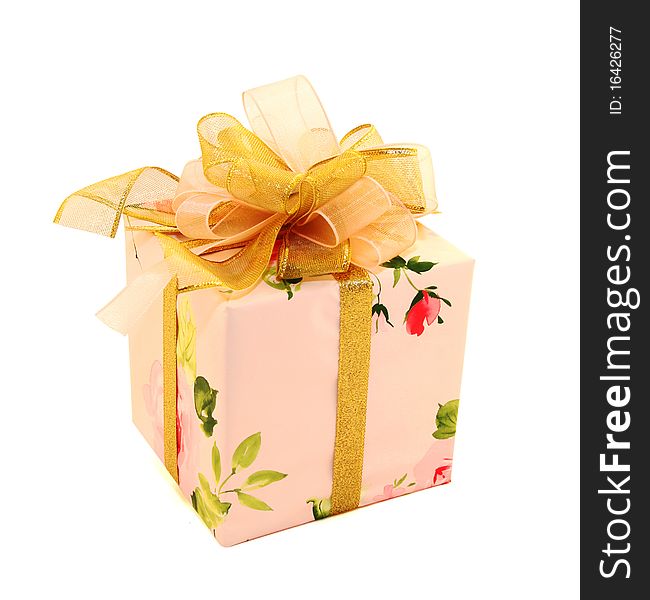 Pink gift box with colors and gold tape on which beautiful gold bow. Pink gift box with colors and gold tape on which beautiful gold bow