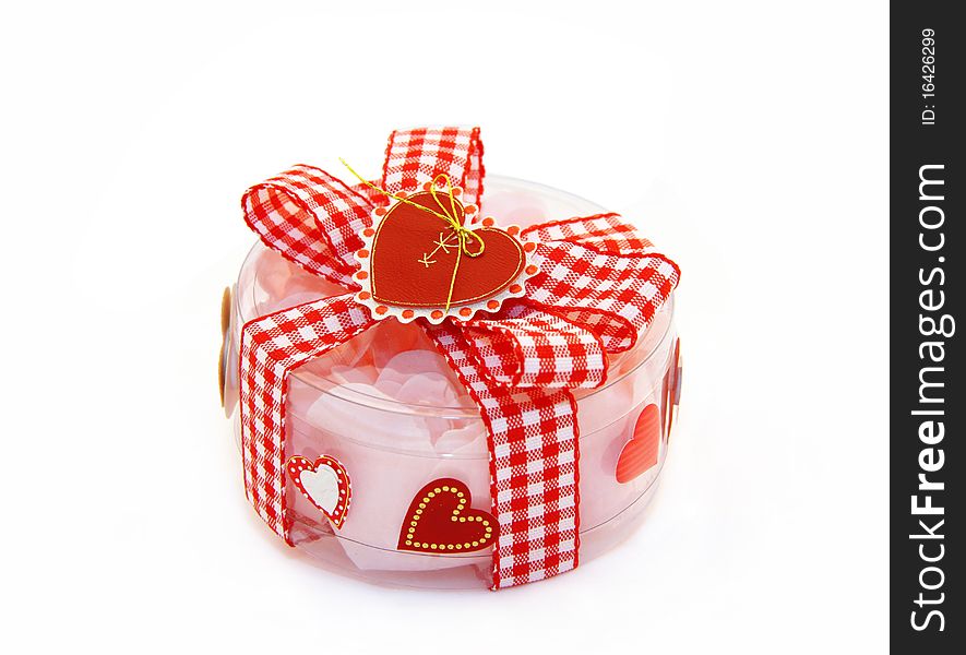 Transparent gift box with a red bow and hearts
