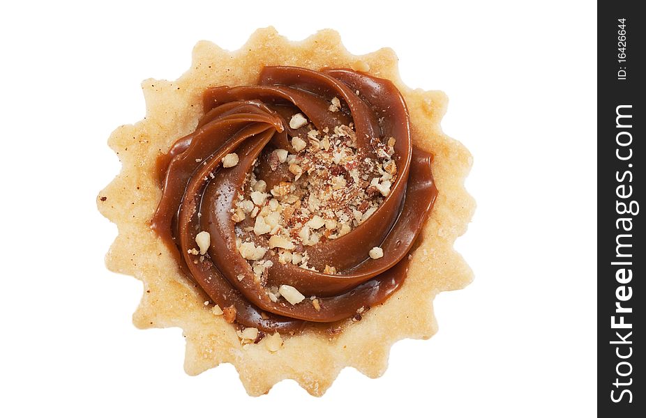 A pastry with nuts isolated over white. Top view.