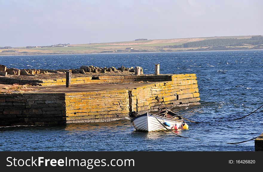 Castletown Harbour, Caithness, Scotland, UK. In a late day it was one of the ports of make slab, a lot of shipping went out this port take Caithness slab all over the World.And in 1820 work began on the construction of Castlehill Harbour, intended to allow the easy transport of flagstones from the local quarries to destinations throughout the British Isles and far beyond: Castlehill flagstone found use in places as far afield as South America and Australia. The first cargo of flagstones left Castlehill Harbour in April 1825: many more were to follow.
The workers in Traill&#x27;s quarry and their families needed somewhere to live, and Traill established a planned village built to a grid pattern inland from Castlehill. This became Castletown and by 1825 was substantially complete. Traill also built Castletown Mill in 1818 to process corn from the surrounding area. Close by is the car park at the end of the beach footpath. This was opened in 2000 and gives access to the excellent beach and dune area to the north east. The 100 people employed in Castletown&#x27;s flagstone industry in 1825 had increased to 500 by the peak year of 1902, when 35,363 tonnes of flag were produced, worth Â£23,239. But by the 1920s concrete paving stones had largely replaced the natural material and the industry died. Today&#x27;s Castletown is a neat village built largely, as you would expect, from the local stone. A series of imposing buildings dominate the centre of the village. The Castletown