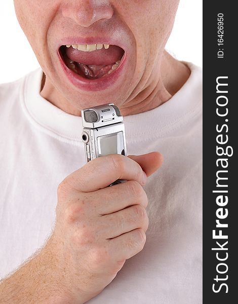 Man open mouth and scream in dictaphone. Close-up