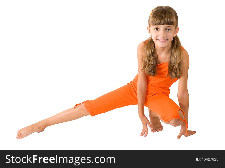 The girl in orange clothes is photographed on the white background