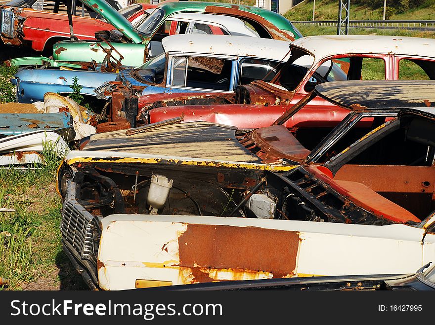 Old abandoned american cars in junkyard. Old abandoned american cars in junkyard.